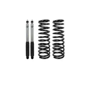 Automotive suspension lift kit with two shocks and two coil springs.