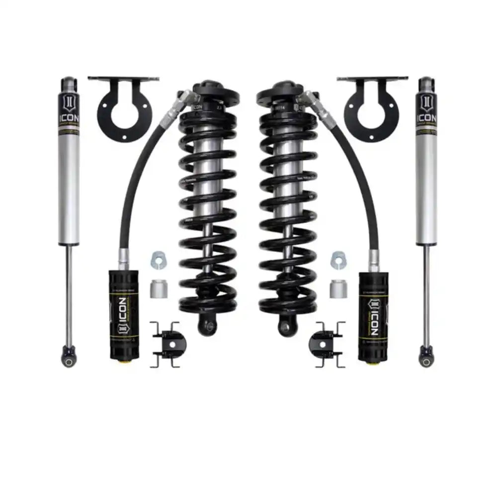Pair of black and silver off-road vehicle suspension kits.