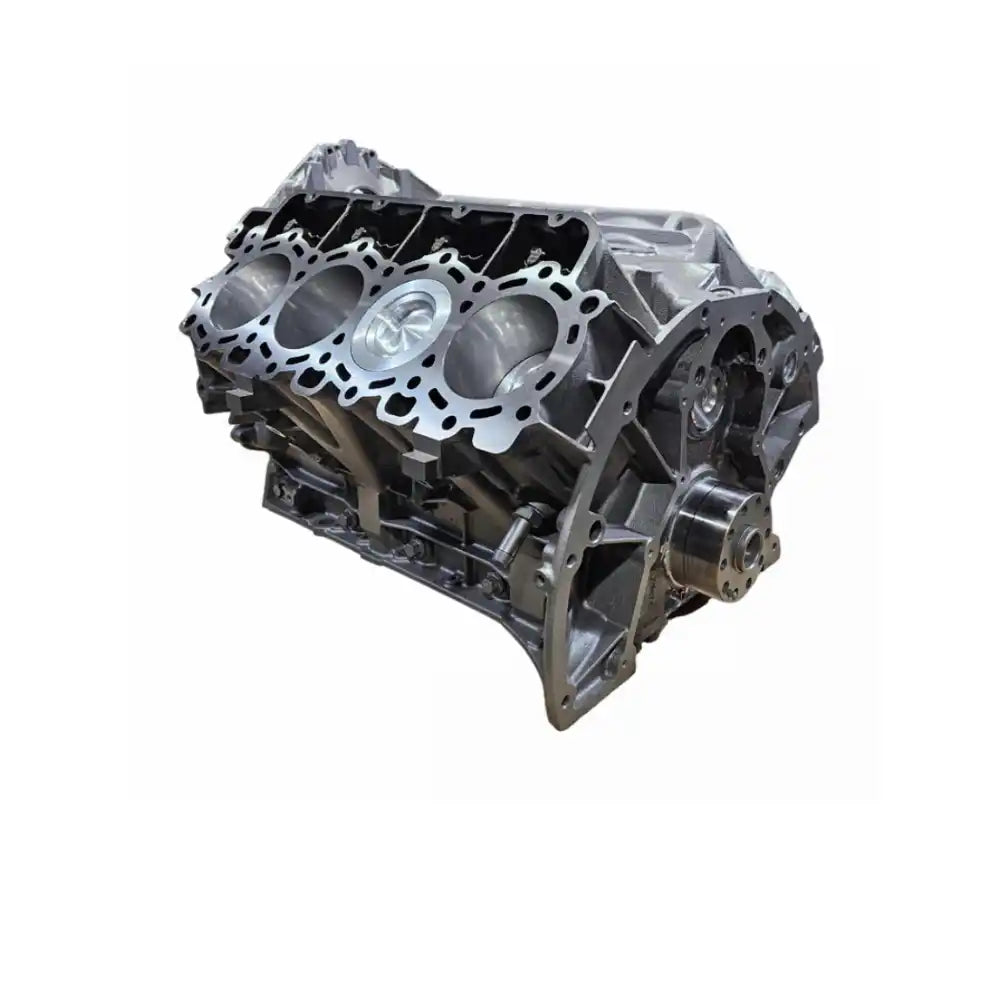 An unpainted V8 engine block with visible cylinder bores.